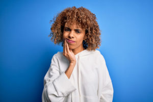 Dental Patient Suffering From An Impacted Wisdom Tooth