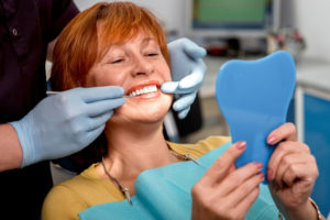 Dental Patient Smiling During Her Full Arch Dental Implant Patient