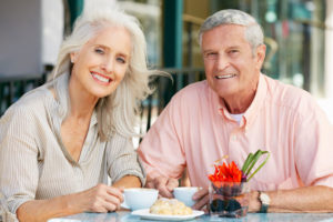 Dental Implant Patients Eating Together With Their False Teeth in Greensburg, PA