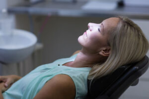 a dental patient under sedation dentistry so she can have an anxiety-free All-On-4 dental implant procedure experience.