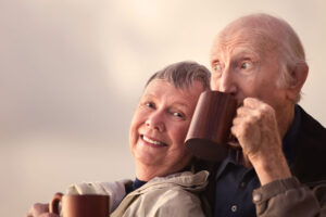 image of older people smiling with dental implants.