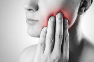 Man with a toothache. Pain in the human body.