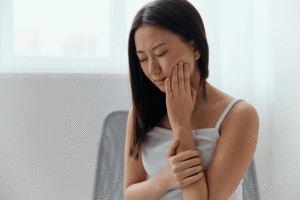 young women unhappy suffering from hurting tooth