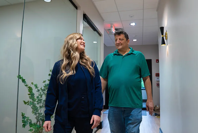 Team member consulting with Paitent