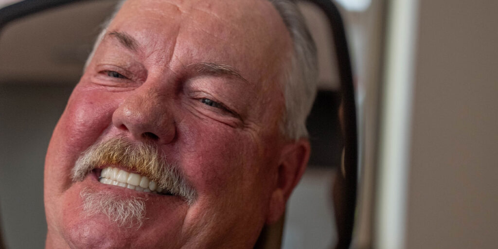 Patient Smiling into mirror