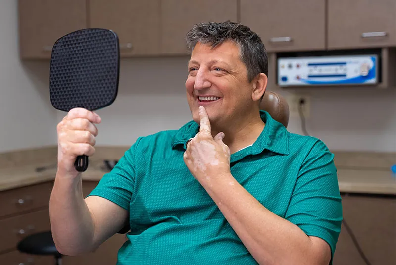 patient smiling brightly after their dental treatment