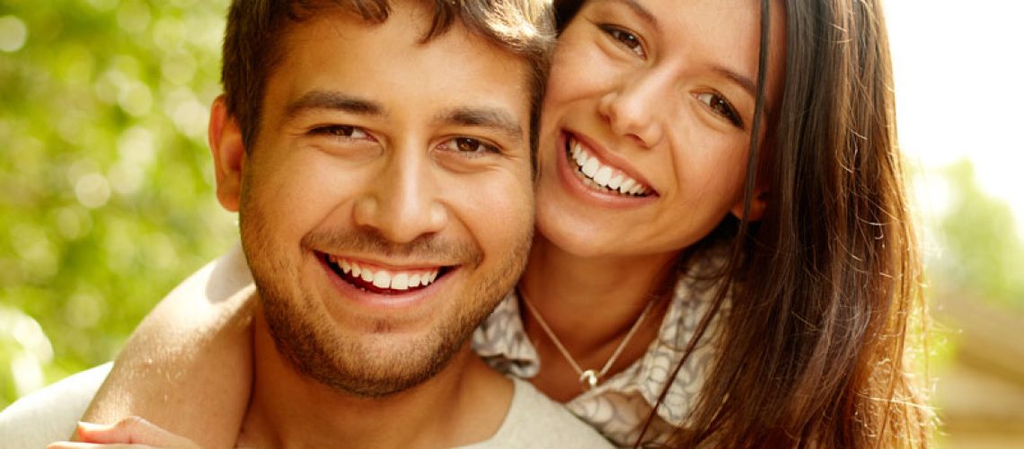Dental Patients Smiling With Well Cared For Dental Implants In Monroeville, PA