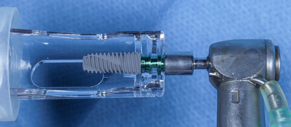a dental implant with a drill attached to it