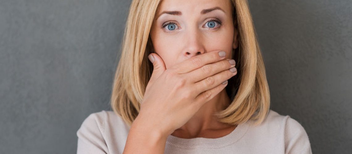 Dental Patient Hiding Her Mouth