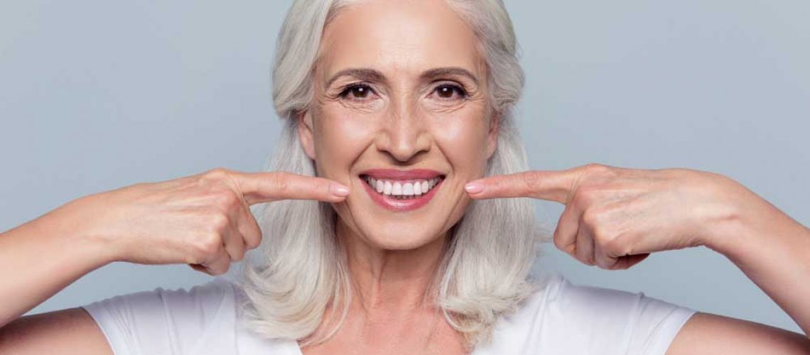 dental patient smiling after all-on-4 dental implants