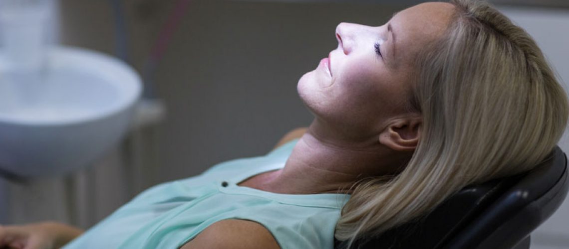 a dental patient under sedation dentistry so she can have an anxiety-free All-On-4 dental implant procedure experience.