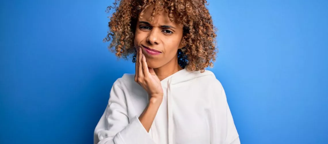 Dental Patient Suffering From An Impacted Wisdom Tooth