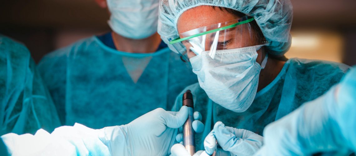 Oral and Maxillofacial surgery resident in training during a surgical simulation training lab